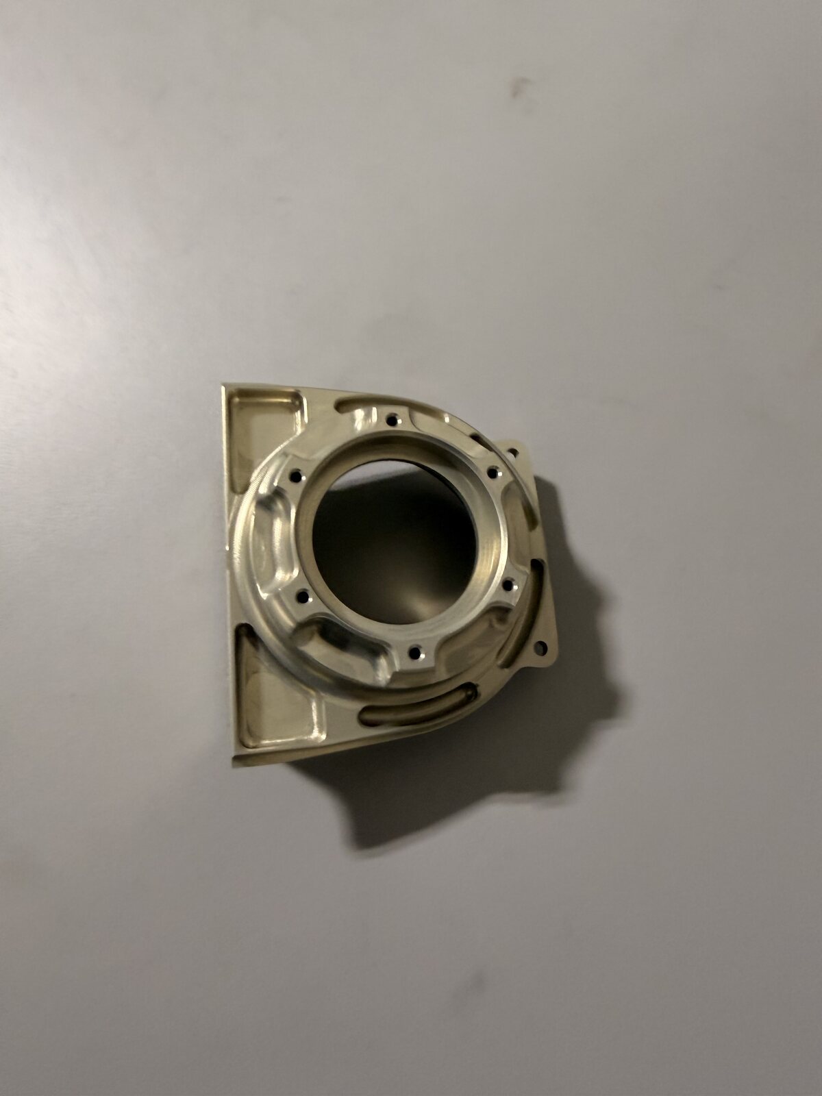 Detailed aluminum component with machined channels and mounting holes